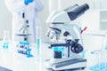 Science microscope equipment in biology chemical laboratory. Scientific experiment Microscope on Lab table microbiology equipment Royalty Free Stock Photo