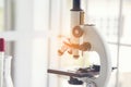 Science microscope equipment in biology chemical laboratory. Scientific experiment Microscope on Lab table microbiology equipment Royalty Free Stock Photo