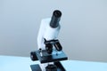 Science. Microscope with glass slide on blurred background, closeup Royalty Free Stock Photo