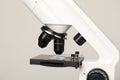 Science. Microscope with glass slide on light grey background, closeup Royalty Free Stock Photo