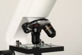 Science. Microscope with glass slide on light grey background, closeup Royalty Free Stock Photo