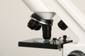 Science. Microscope with glass slide on light grey background, closeup Royalty Free Stock Photo