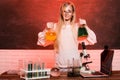 Science and school education. Funny girl doing experiments in the laboratory. Explosion in the laboratory. Kid scientist