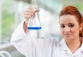 Science student holding an Erlenmeyr flask Royalty Free Stock Photo