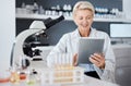 Science, tablet and research woman with microscope data analytics, test results and laboratory software management