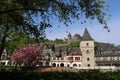 Scenic view at historic half-timbered houses, medieval tower and castle on hilltop