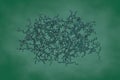 Molecular model of human cathepsin K with a covalently-linked inhibitor on dark green background. Rendering based on