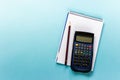 Scientific calculator with notepad and pen Royalty Free Stock Photo