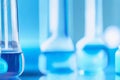 Scientific Composition: Test Tubes on a Table with a Blue Blur. Royalty Free Stock Photo