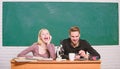 Scientific experiment. Guy and girl at desk with microscope. Studying in college or university. Biology lesson. Students