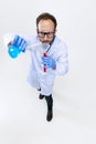 High angle view of young chemist, doctor conducts chemical research isolated on white background. Concept of Royalty Free Stock Photo