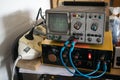 Scientific experiment with oscilloscope showing a sine wave