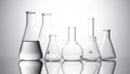 Scientific Laboratory Glassware on a Reflective Surface Royalty Free Stock Photo