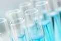 Scientific laboratory research and experiments. Laboratory test tubes with blue liquid close-up, selective focus Royalty Free Stock Photo