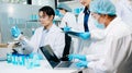 A scientific research team collaborating in a modern laboratory, conducting experiments, analyzing samples, and using advanced lab Royalty Free Stock Photo