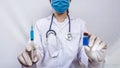 Scientific researcher or doctor using syringe and vaccine in a laboratory with white background. A doctor Filling vaccine to Royalty Free Stock Photo