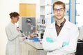 Scientific researchers making experiment in laboratory Royalty Free Stock Photo