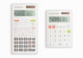 Scientific and simple calculators with solar cell in white color. Royalty Free Stock Photo