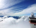 A scientific station for monitoring natural phenomena is located in the mountains above the clouds