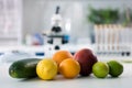 Scientific tools and fruits at workplace Royalty Free Stock Photo