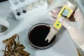 A scientist analyzes soybeans in a chemical laboratory. Close-up.