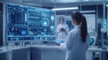 Scientist analyzing data in high-tech laboratory during a research project in the evening
