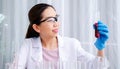 Scientist beautiful woman research and drop medical chemicals sample in test tube at laboratory, Science, chemistry, technology, Royalty Free Stock Photo