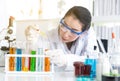 Scientist beautiful woman working putting medical chemicals sample in test tube at lab Royalty Free Stock Photo