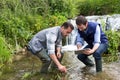 Scientist and biologist working together on water analysis