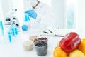 Scientist check chemical food residues in laboratory. Control experts inspect quality of fruits, vegetables. lab, hazards, ROHs,