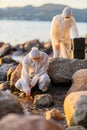 Scientist collecting water sample at the seashore Royalty Free Stock Photo