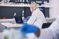 Scientist, computer screen and DNA research, genetics analysis and study in medical laboratory. Doctor or woman on