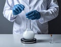 Scientist Conducting Laboratory Experiment with Test Tube and Flask Royalty Free Stock Photo