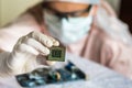 Scientist develops microchip and checking electronic circuit Royalty Free Stock Photo