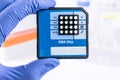 Scientist with DNA Sequencing Chip. Medical laboratory.