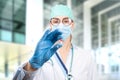 Scientist doctor holding a red and white pill with futuristic virtual low poly drawing. Future illness cure. Medicine concept