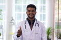 Scientist or doctor standing and show thump up in scientific lab