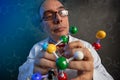 Scientist examining the building blocks of model molecules Royalty Free Stock Photo