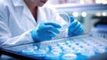 Scientist examining petri dish in laboratory