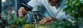 Scientist Examining Plant Specimen Under a Microscope