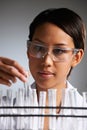 Scientist Examining Rack Of Test Tubes Royalty Free Stock Photo