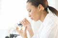 Scientist Examining Solution In Petri Dish At Laboratory