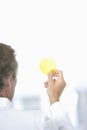 Scientist Examining Yellow Petri Dish