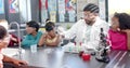 Scientist explaining chemical reactions to children over molecular structure image Royalty Free Stock Photo