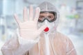 Scientist with FFP3 respirator mask is showing STOP gesture Royalty Free Stock Photo