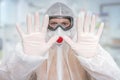 Scientist with FFP3 respirator mask is showing STOP gesture Royalty Free Stock Photo