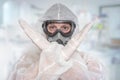 Scientist with FFP3 respirator mask is showing STOP gesture Royalty Free Stock Photo