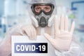 Scientist with FFP3 respirator mask is showing STOP gesture Royalty Free Stock Photo