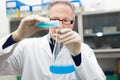 Scientist Filling An Erlenmeyer Flask