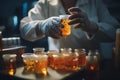 scientist filtering small amount of brown and bubble liquid in lab room